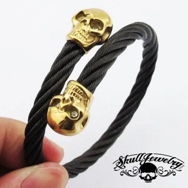9" Black Steel Cable Bracelet with Double GOLD Overlay Skulls and White Gem Stone Eyes (846)
