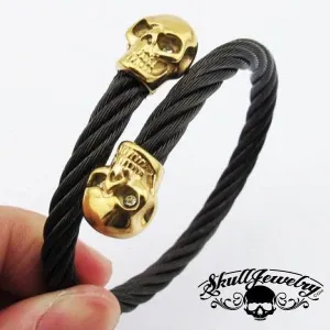 9" Black Steel Cable Bracelet with Double GOLD Overlay Skulls and White Gem Stone Eyes (846)