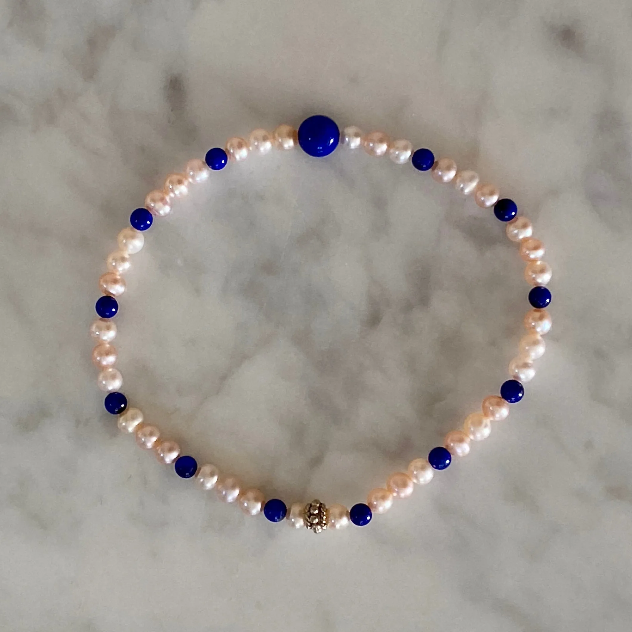 Arpaia 7.25" Stretch Bracelet with Natural Lapis Lazuli Beads, Natural Blush Pink Color Cultured Freshwater Pearls, and Handmade Sterling Silver Bali-Style Bead