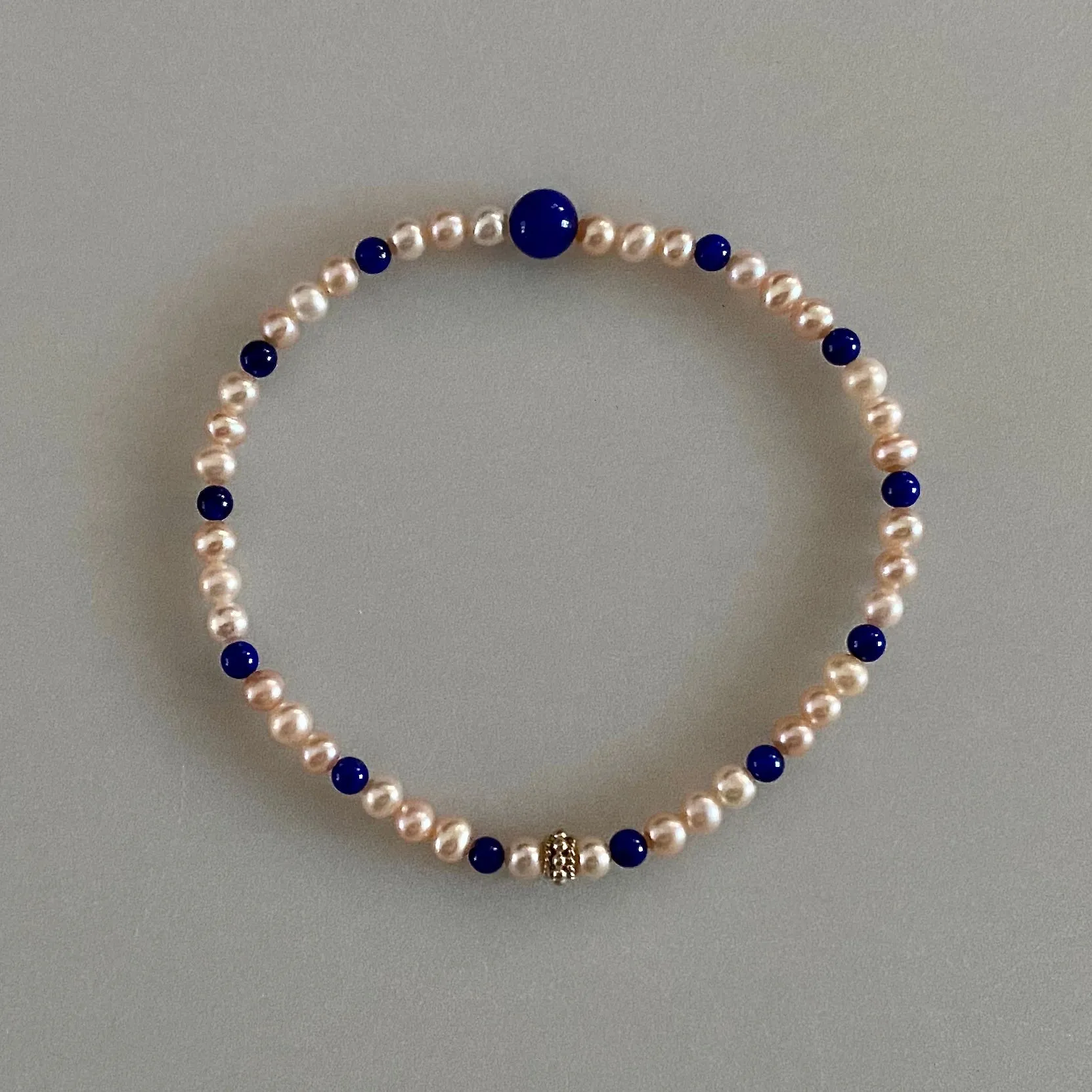 Arpaia 7.25" Stretch Bracelet with Natural Lapis Lazuli Beads, Natural Blush Pink Color Cultured Freshwater Pearls, and Handmade Sterling Silver Bali-Style Bead