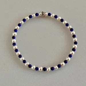 Arpaia 7.25" Stretch Bracelet with Natural Lapis Lazuli Beads, White Baby Cultured Freshwater Pearls & Handmade Sterling Silver Bali Bead
