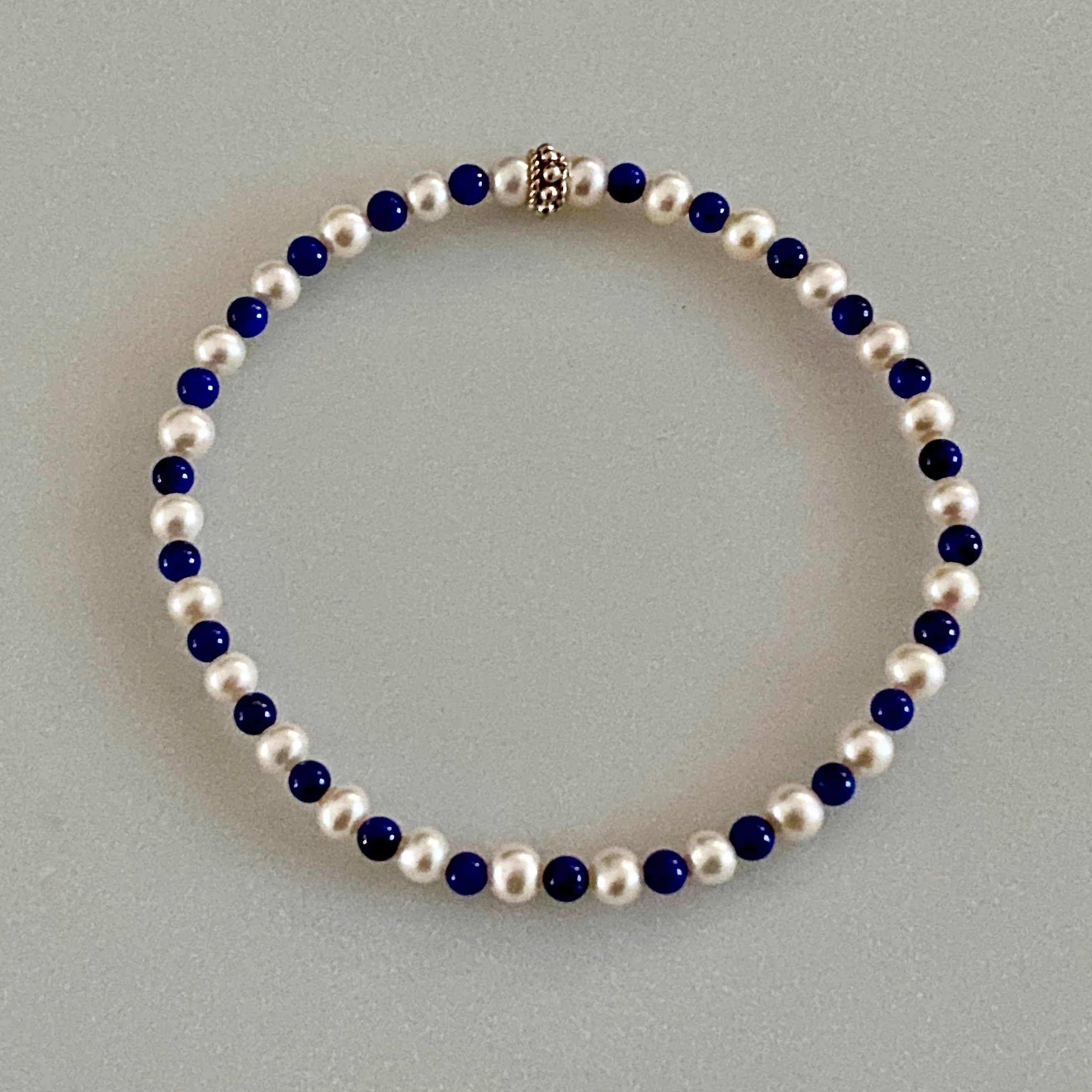 Arpaia 7.25" Stretch Bracelet with Natural Lapis Lazuli Beads, White Baby Cultured Freshwater Pearls & Handmade Sterling Silver Bali Bead