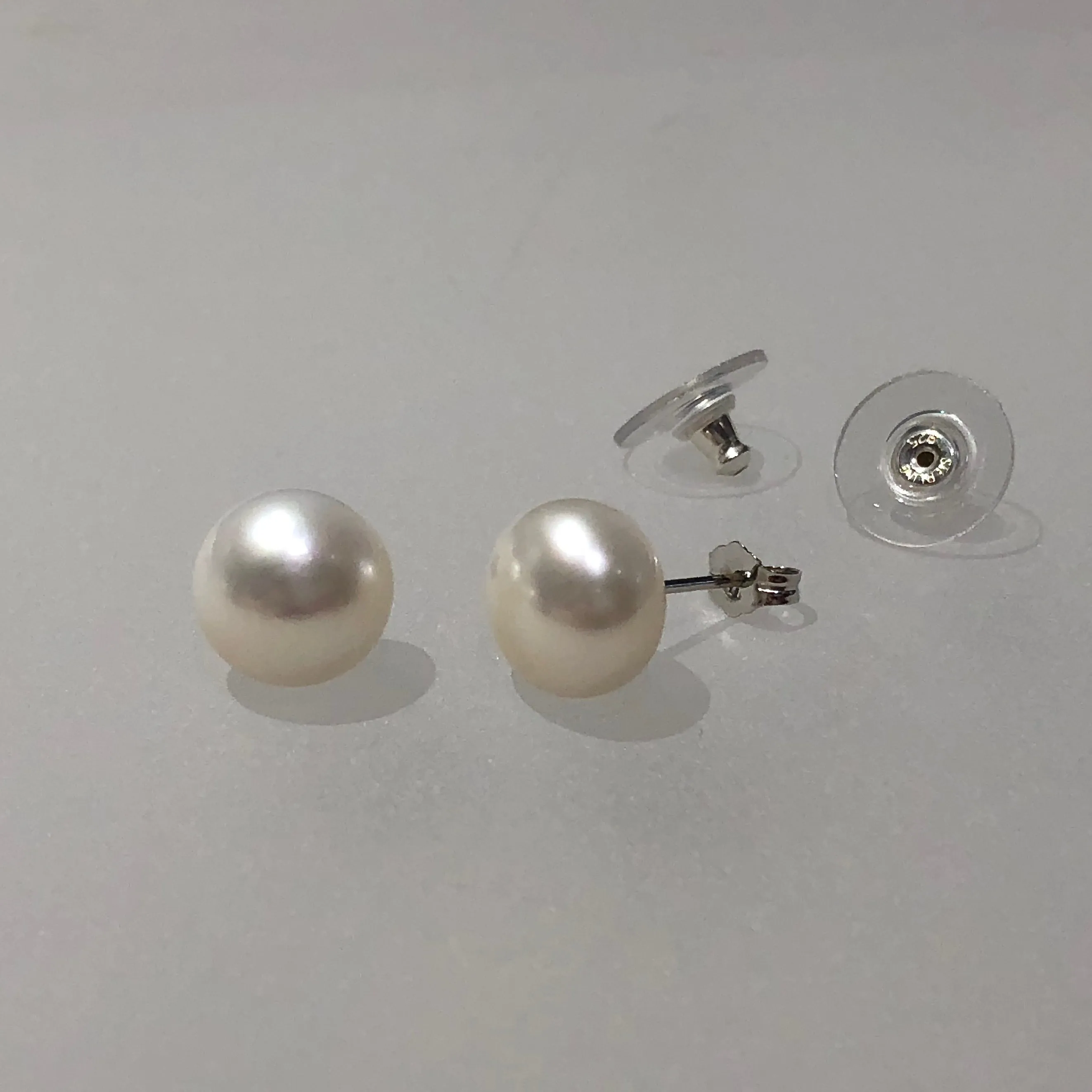 Gem Quality 11-11.5mm Button Shape White Cultured Freshwater Pearl Post Earrings in Rhodium Plated Sterling Silver