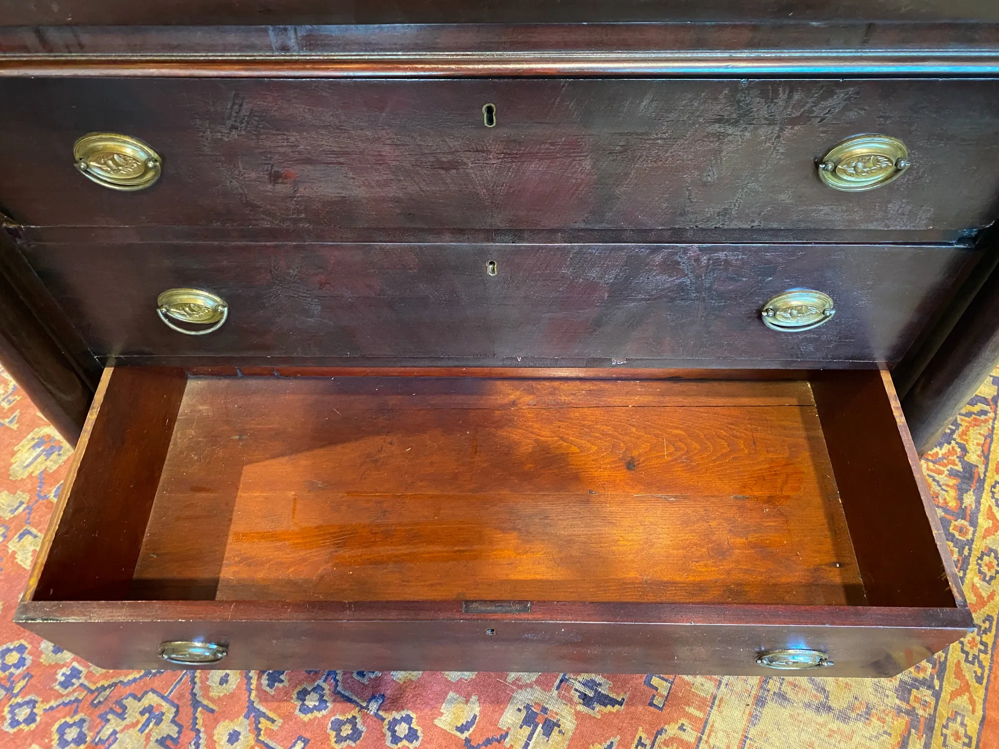Large Empire Carved Chest of Drawers with Paw Feet and Brass Hardware