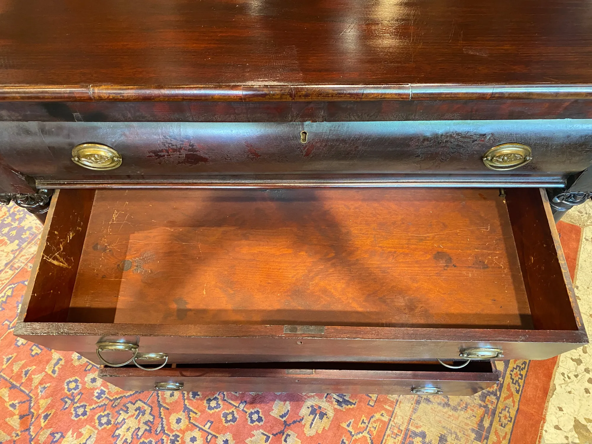 Large Empire Carved Chest of Drawers with Paw Feet and Brass Hardware