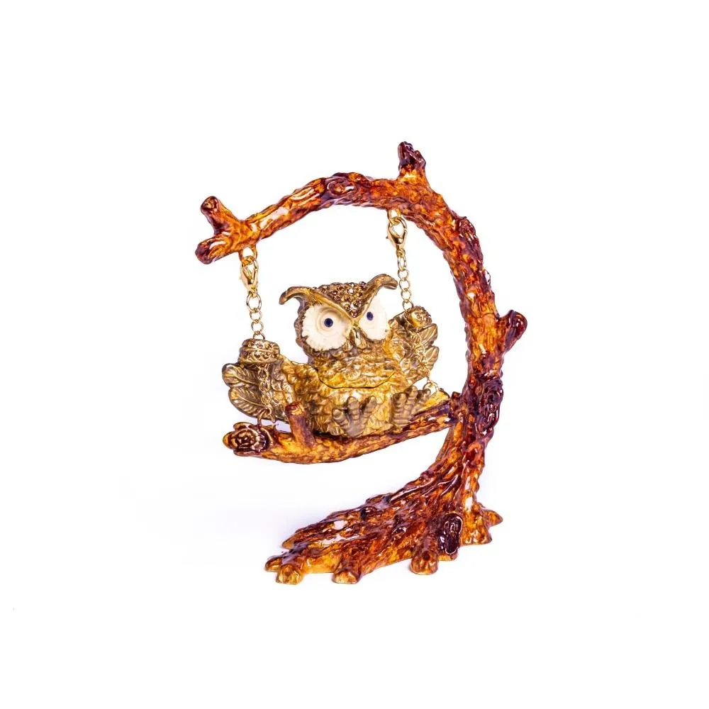 Owl Swinging on a Tree Branch