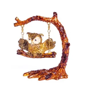Owl Swinging on a Tree Branch