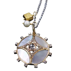 She Gleams: diamonds, mother of pearl in gold necklace