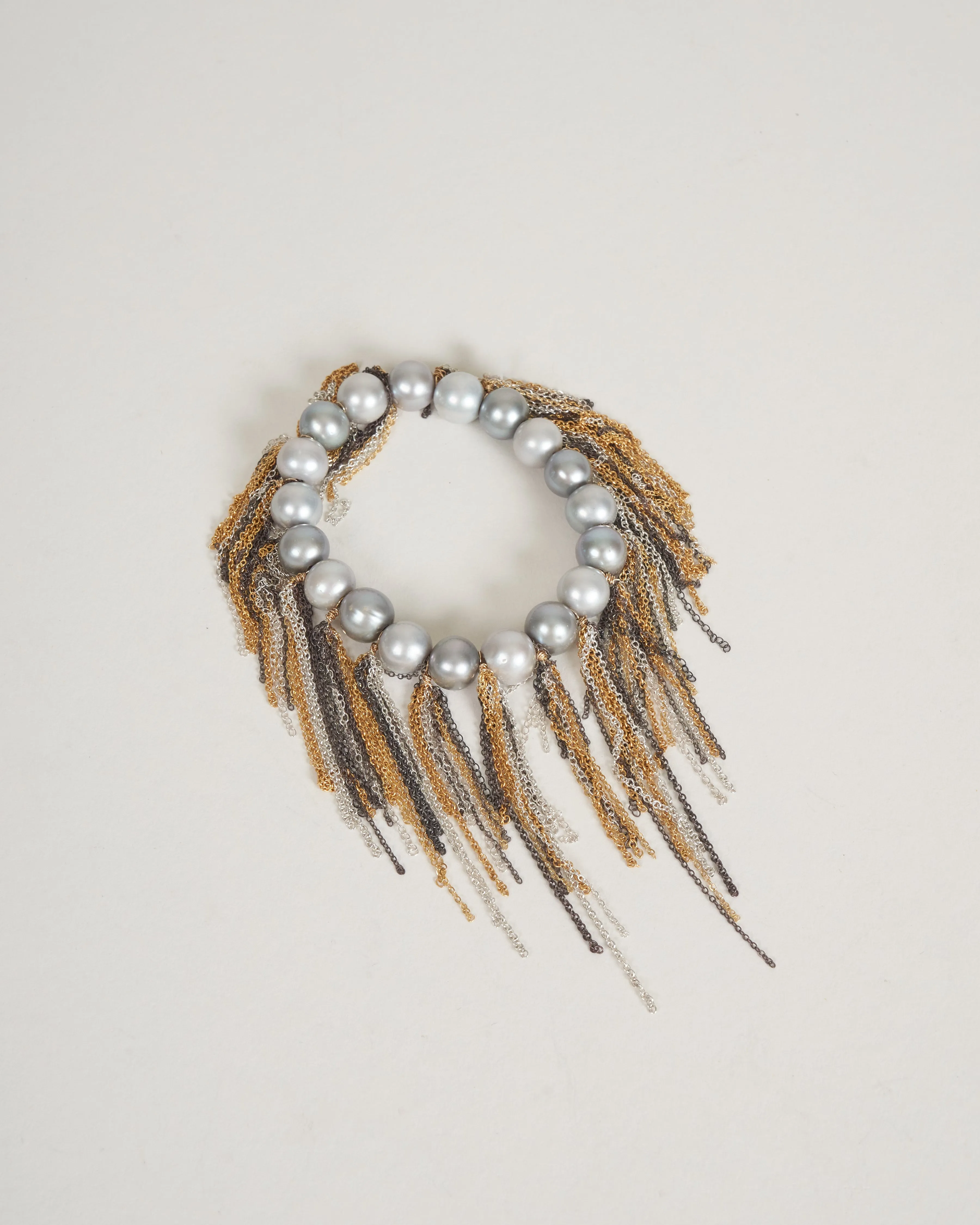 silver freshwater pearls w/ oxi, yellow, and white fringe bracelet