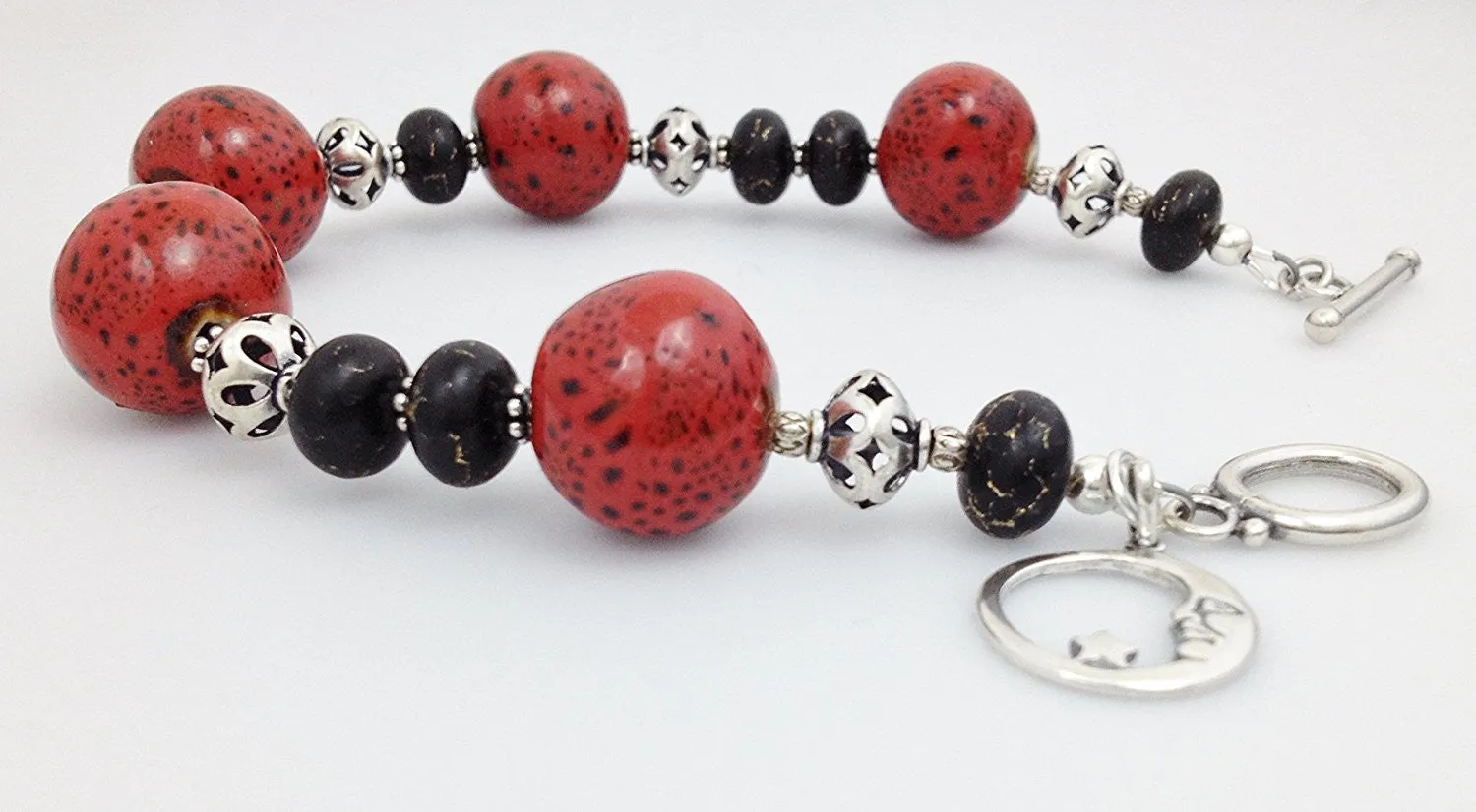 Sterling Silver, Red/ Black Raku Porcelain and Bronze Infused Black Turquoise Bracelet
