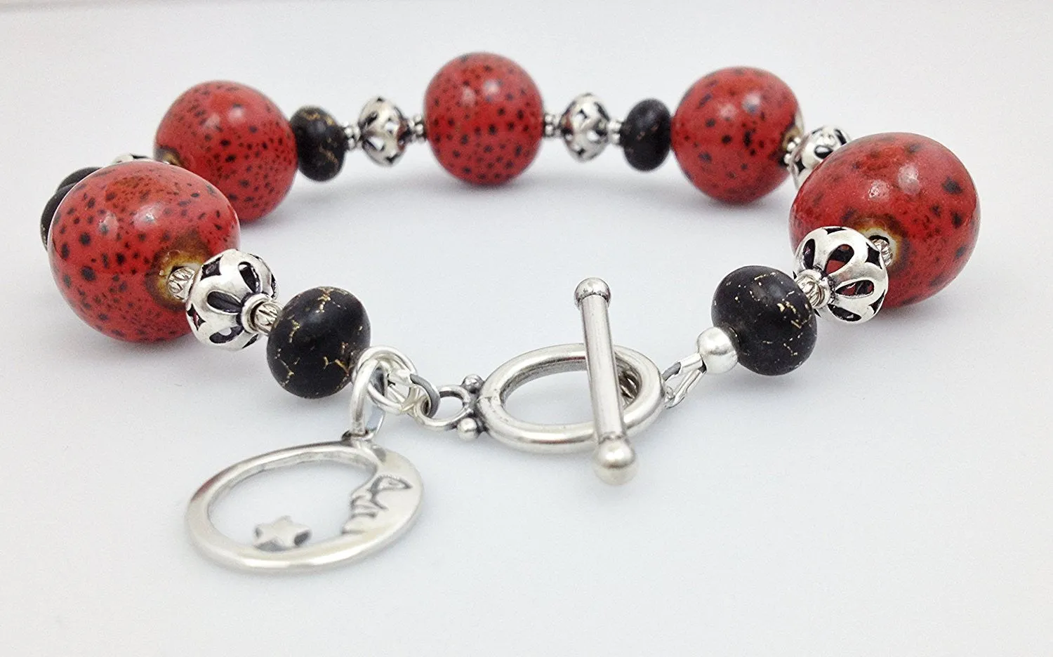 Sterling Silver, Red/ Black Raku Porcelain and Bronze Infused Black Turquoise Bracelet