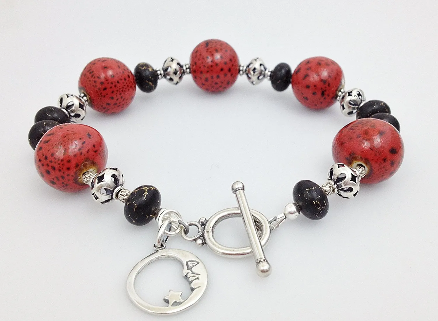 Sterling Silver, Red/ Black Raku Porcelain and Bronze Infused Black Turquoise Bracelet