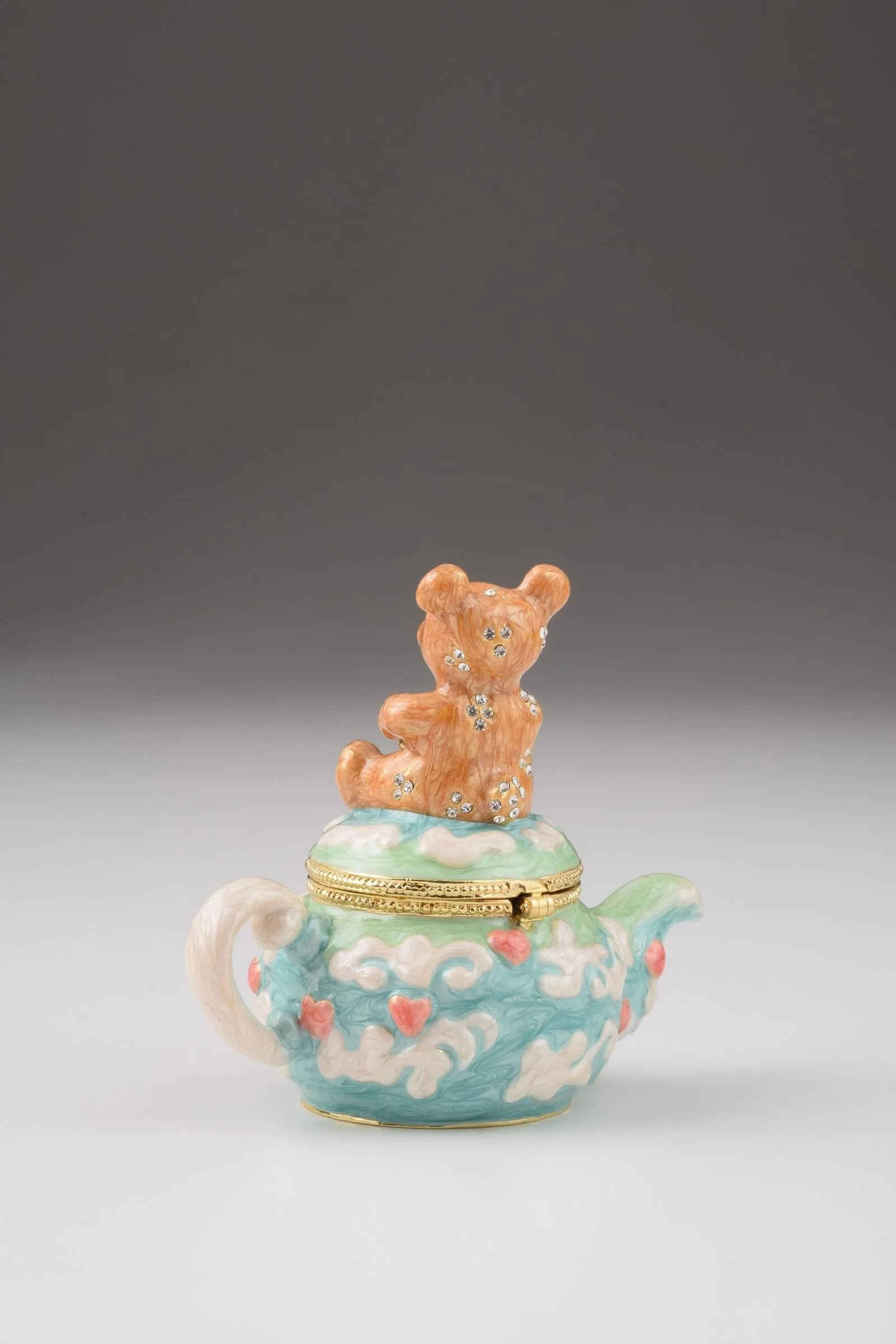 Teddy Bear Sitting on a Teapot
