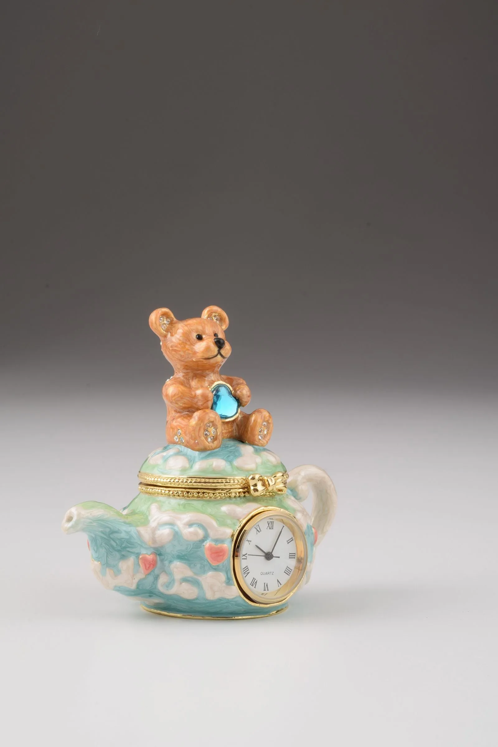 Teddy Bear Sitting on a Teapot