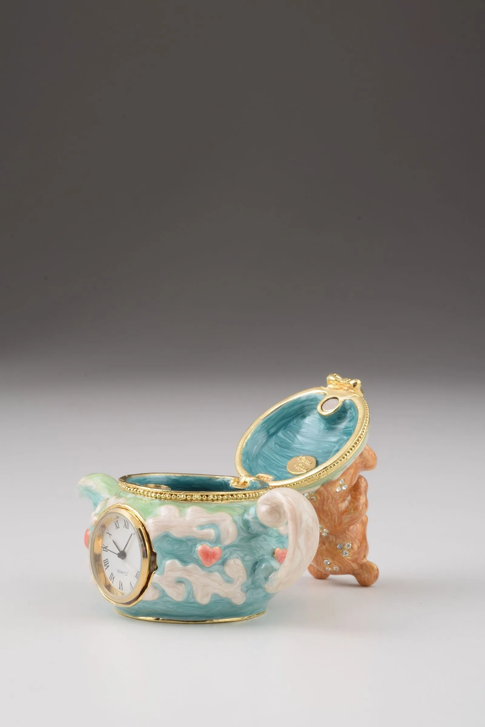 Teddy Bear Sitting on a Teapot