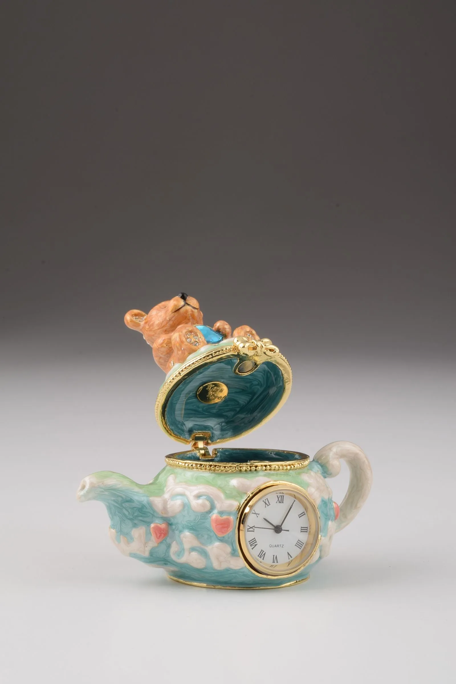 Teddy Bear Sitting on a Teapot
