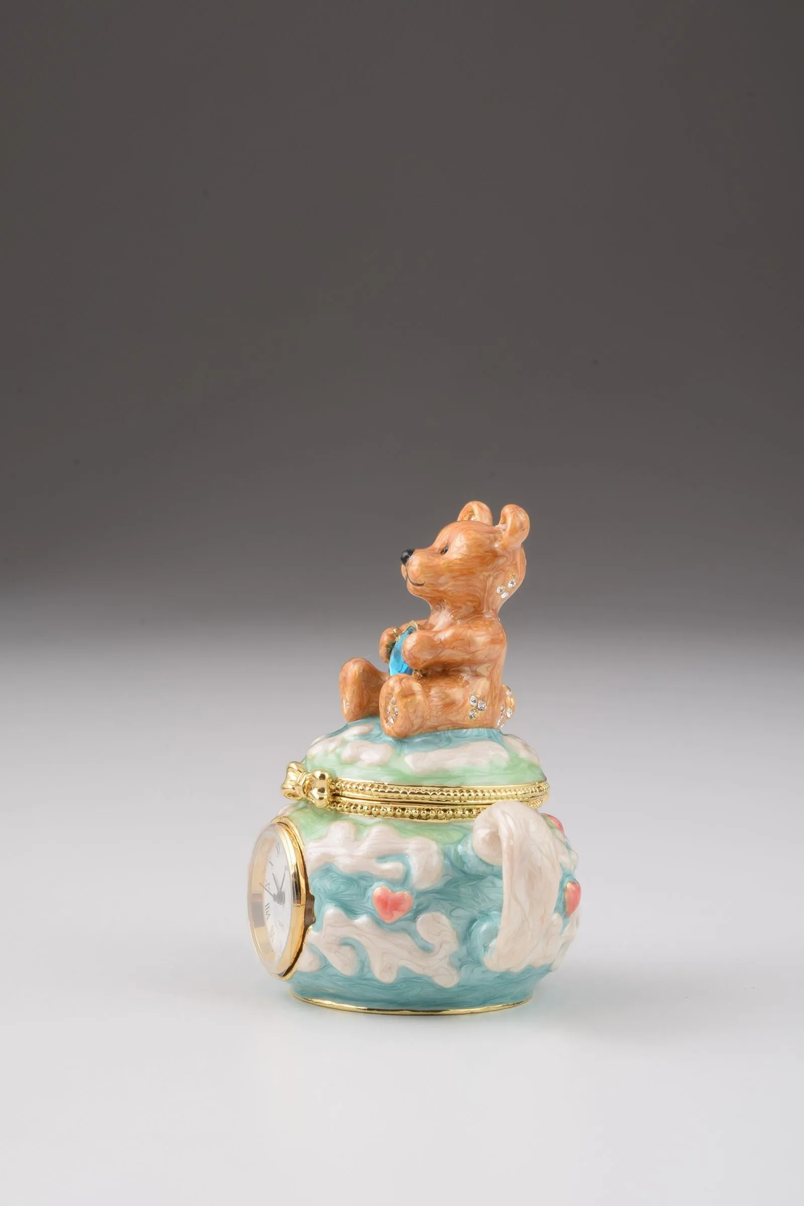 Teddy Bear Sitting on a Teapot