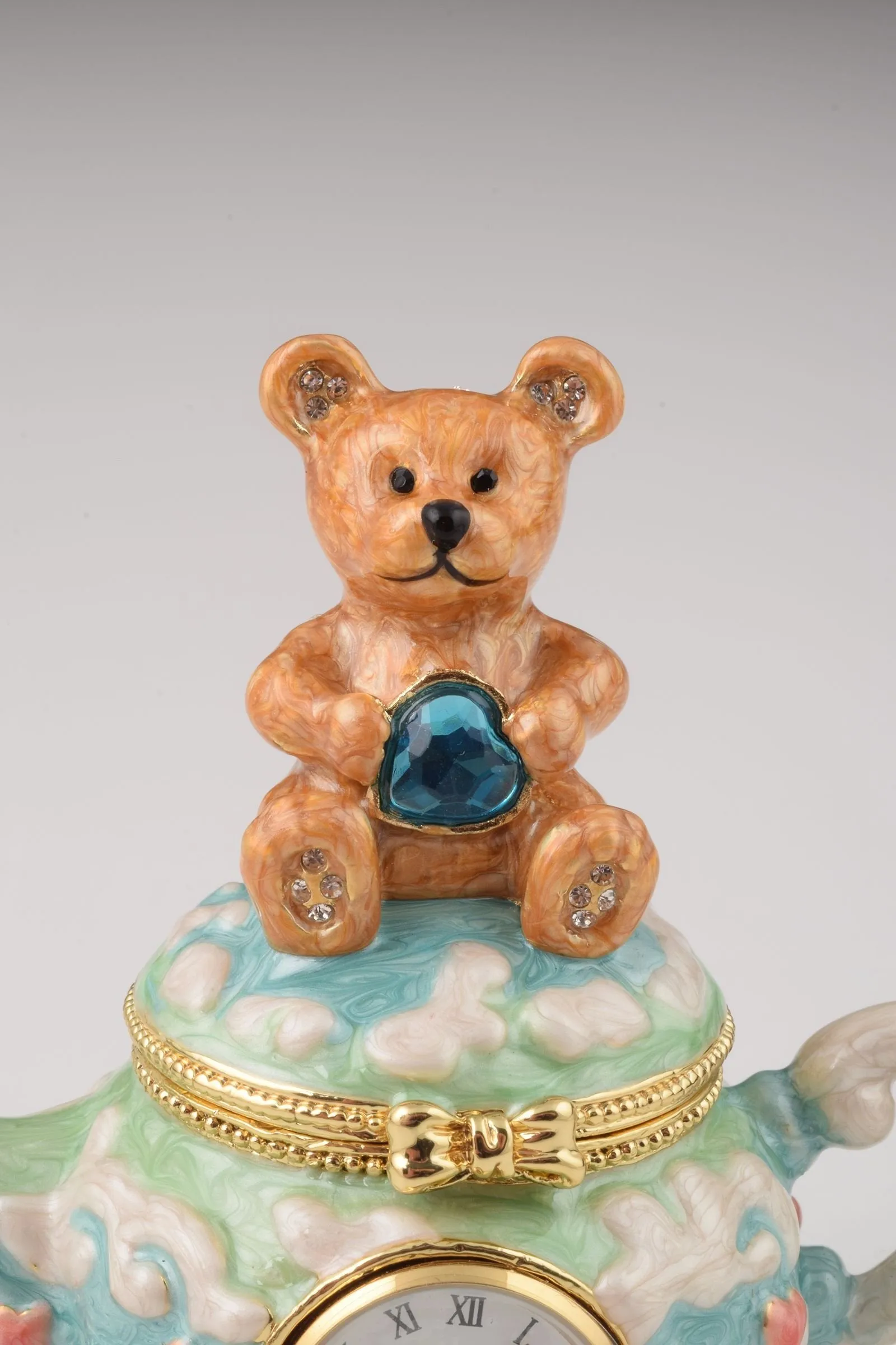 Teddy Bear Sitting on a Teapot
