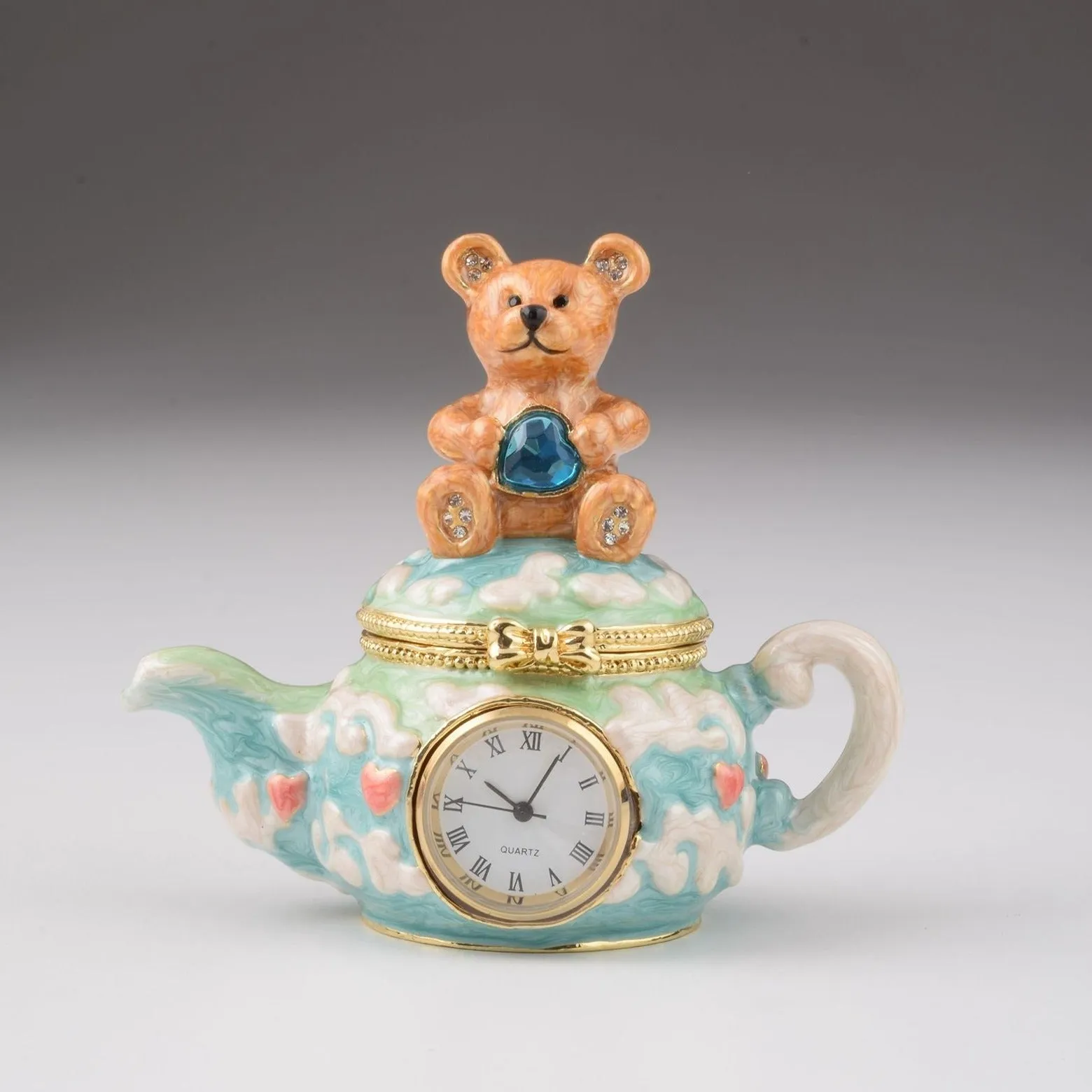 Teddy Bear Sitting on a Teapot
